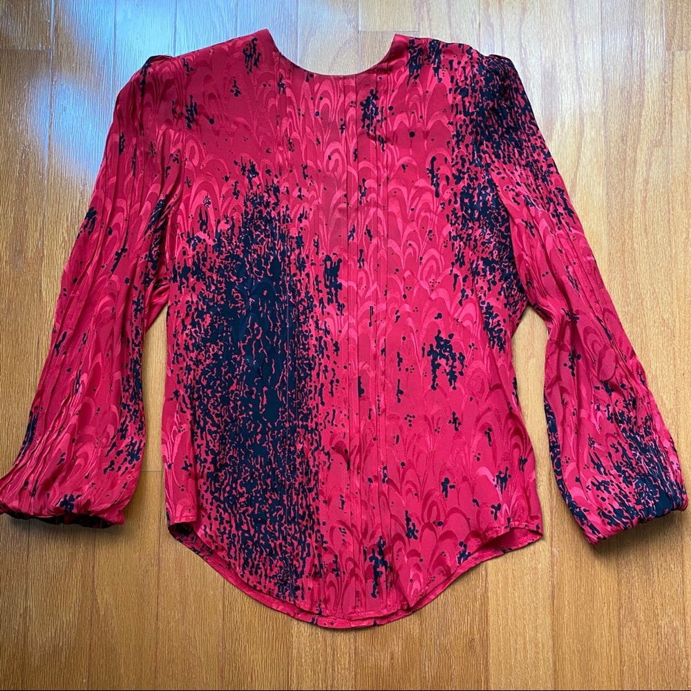 Asymmetrical black on red print long sleeve blouse